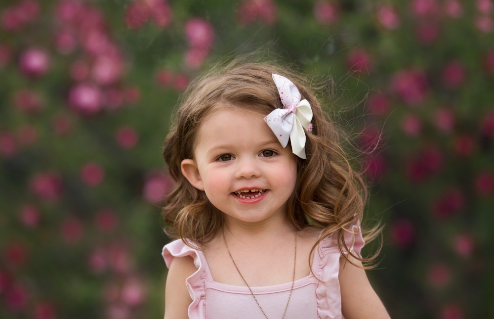 photo of child in the spring flowers